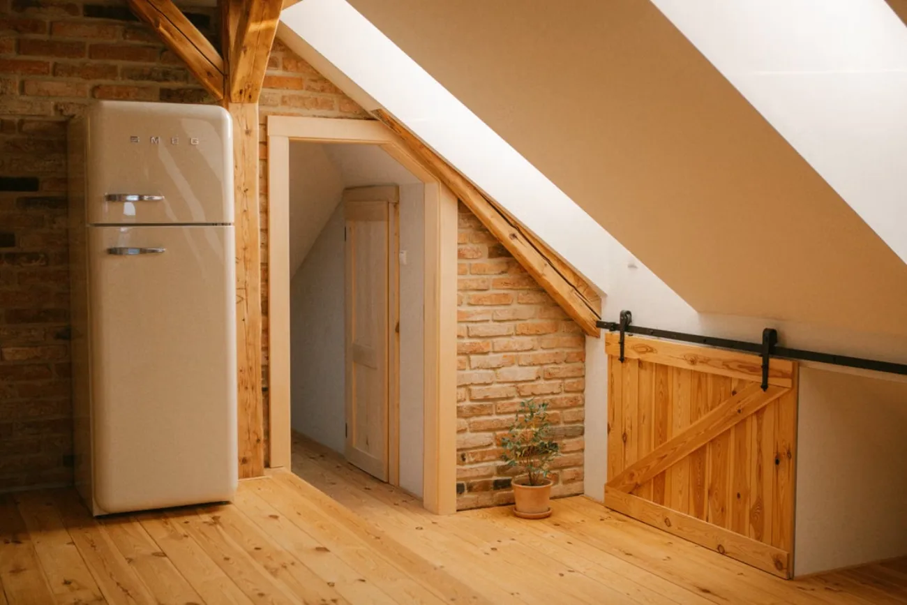 Interior of a finished attic space with wooden detailing in an East Tennessee home
