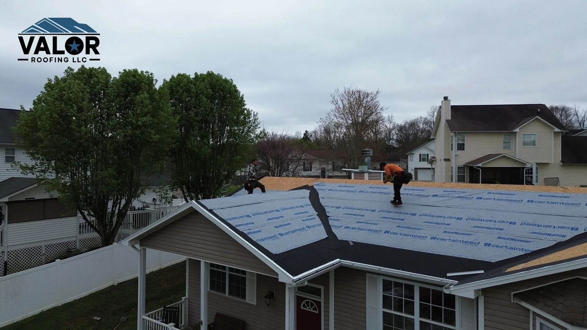 Seamless gutter along the eave of a home during a roof installation
