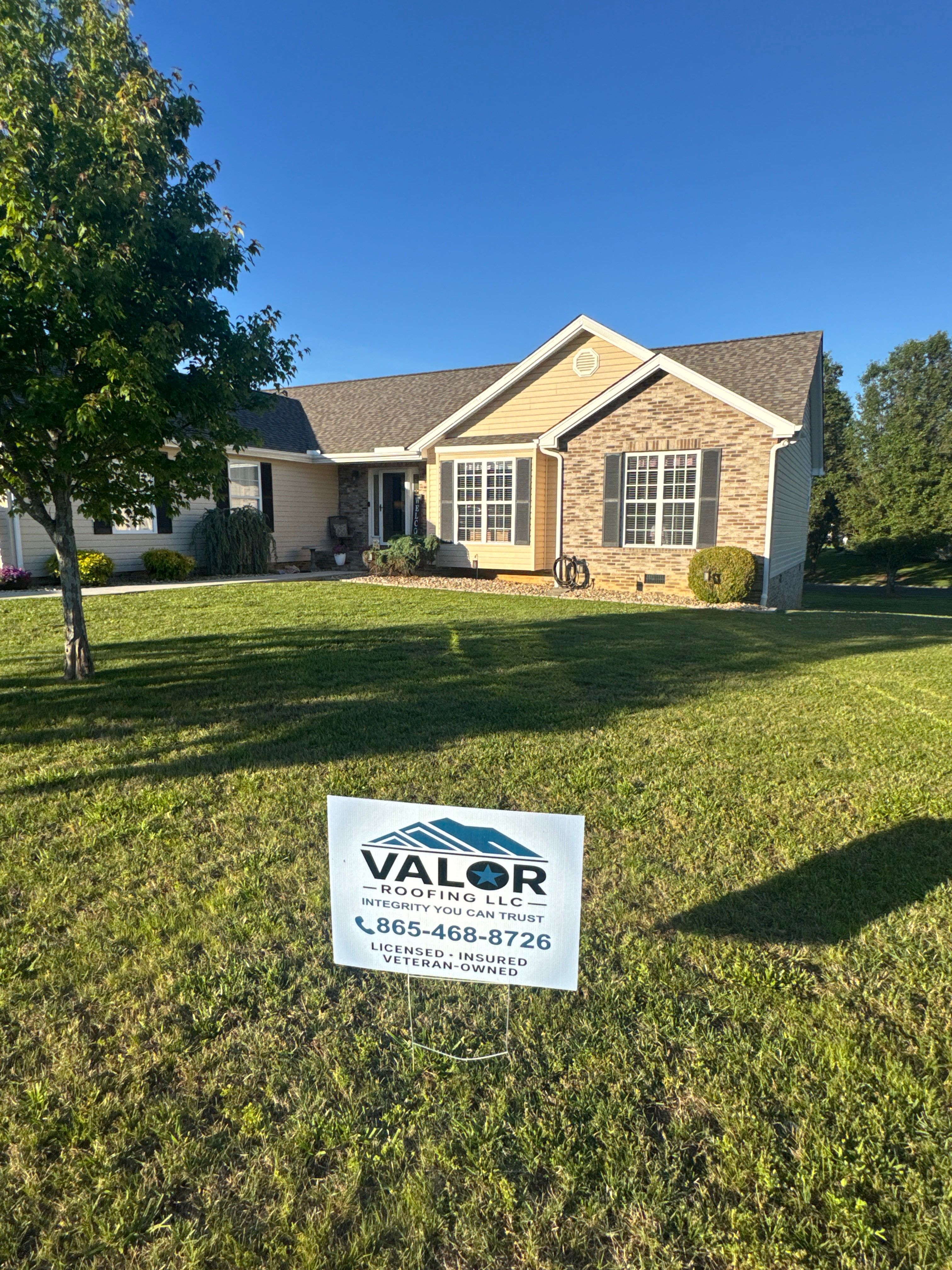 Valor Roofing crew tarping a storm-damaged roof in Knoxville, TN